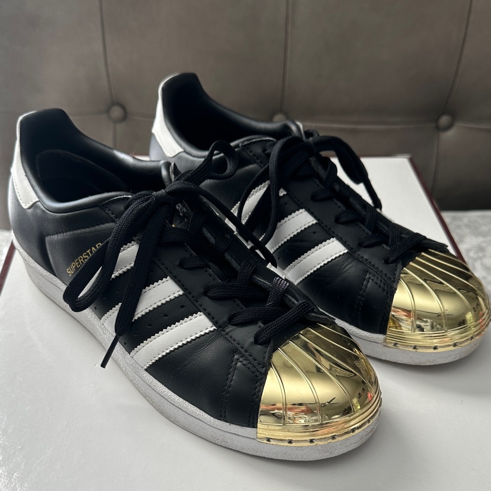 Adidas Women's Black and Gold Superstar Sneakers